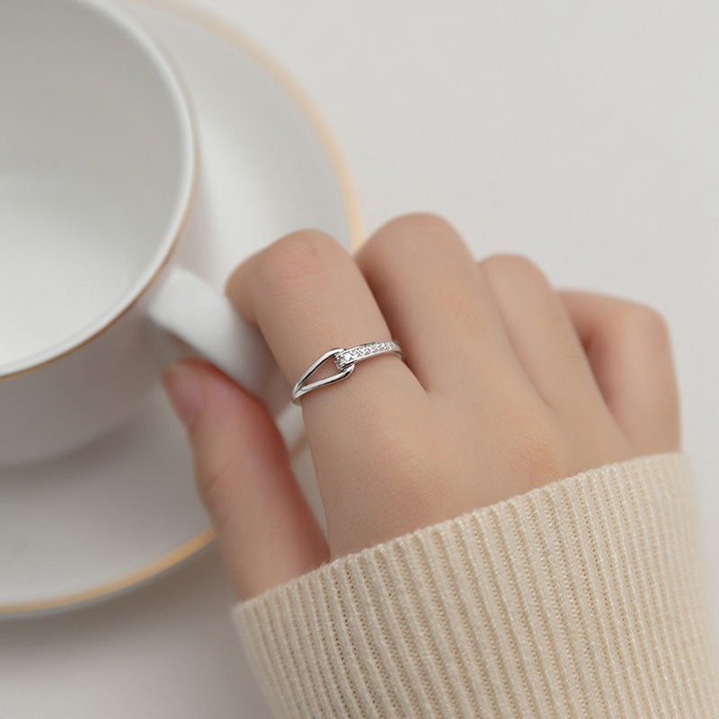 Approximately long diamond hollow titanium steel ring, female niche design, light luxury, fashionable and personalized ring